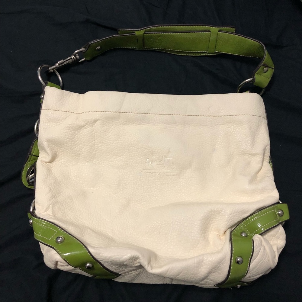 White coach bag with green handles